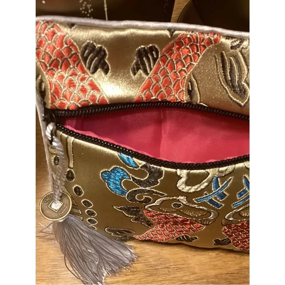 NWT. Gold Embroidered Fish Tassel Wristlet Clutch